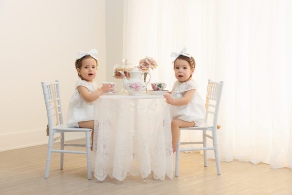 twin girls at a studio tea party