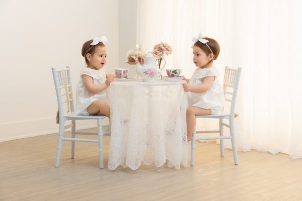 two year old twin girls at a tea party studio session