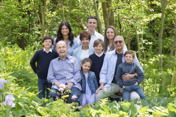 extended family session where everyone is dressed in blue