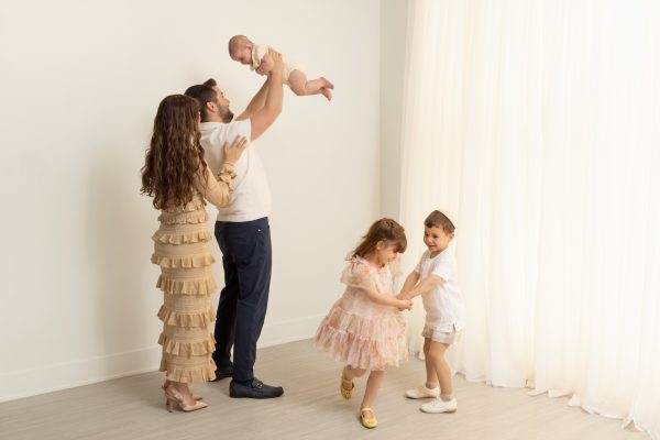 candid image of a family during a studio session