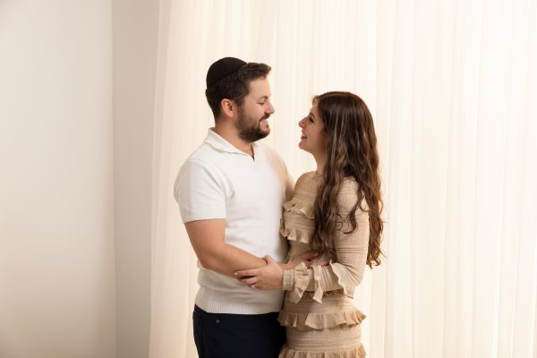 couple embracing in a natural light studio session