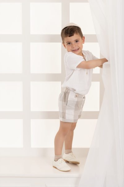 boy standing on window sill in a chicago studio