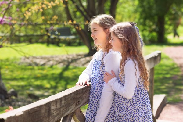 two sisters gazing into the distance