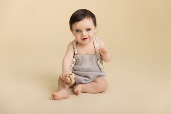baby boy on cream backdrop in a chicago studio