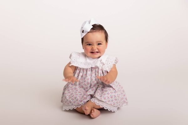 Heirloom portrait on a baby girl on a white backdrop