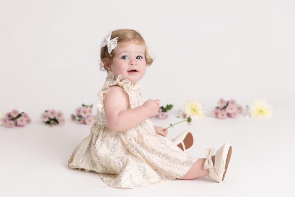 one year old girl posed at her floral session