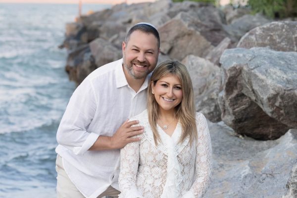 couple smiling during a beach session at Gillson Beach in Wilmette Chicago