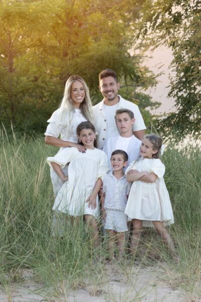 Family posing together on the shore of Lake Michigan in Wilmette