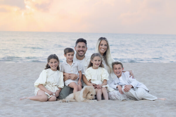 Family posing together on the shore of Lake Michigan in Wilmette at Gillsons Beach